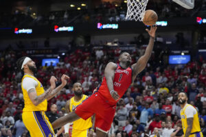 ASSOCIATED PRESS
                                New Orleans Pelicans forward Zion Williamson goes to the basket ahead of Los Angeles Lakers forward Anthony Davis on Tuesday.