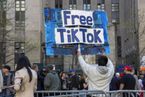 ASSOCIATED PRESS
                                A man carries a Free TikTok sign in front of the courthouse where the hush-money trial of Donald Trump began Monday in New York. The House has passed legislation today to ban TikTok in the U.S. if its China-based owner doesn’t sell its stake, sending the bill to the Senate.
